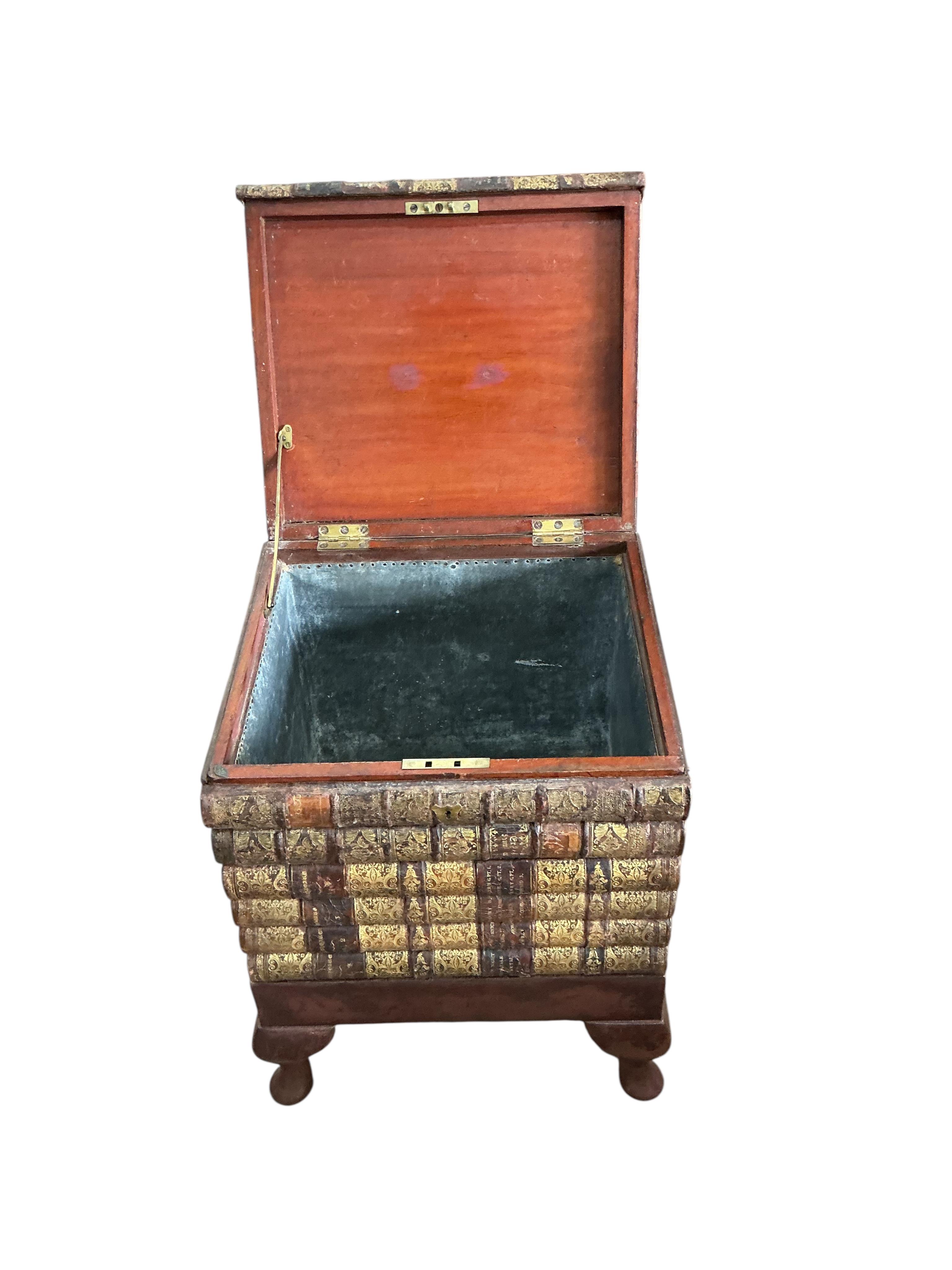 A reproduction cellarette modelled as a stack of antiquarian books, width 42cm, depth 37cm, height 58cm